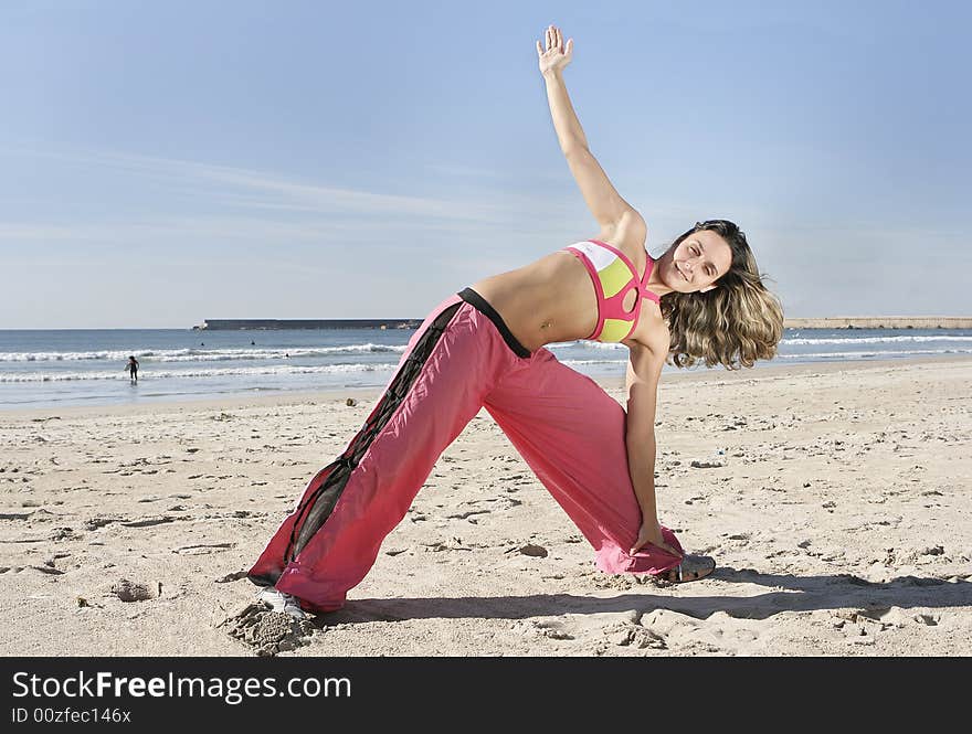 Woman stretching at the beach