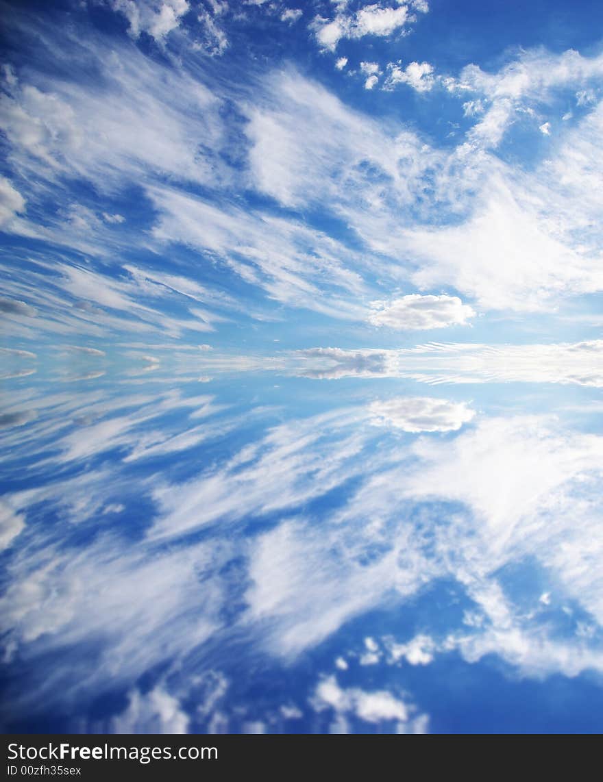 White clouds in a beautiful sky and its reflection