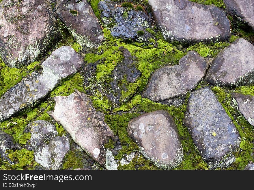 Old wall with moss among the stones. Old wall with moss among the stones