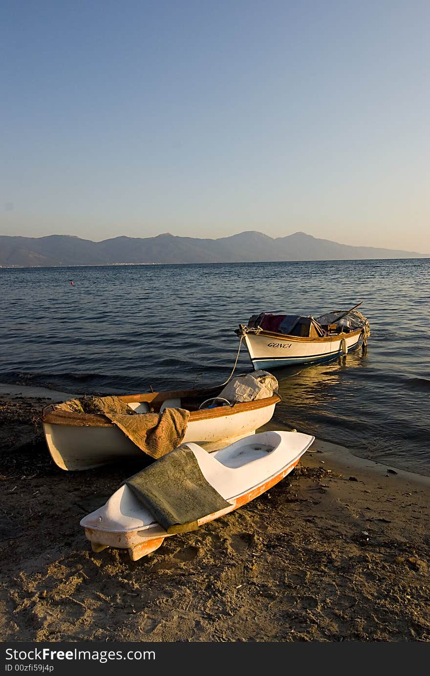 A few boats by the seaside