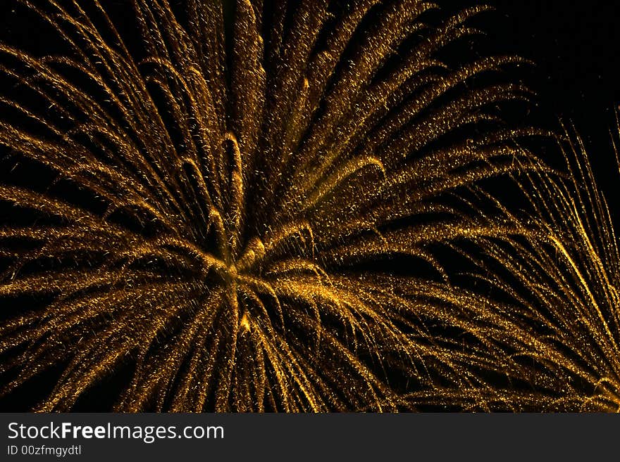 Yellow fireworks in black sky. Yellow fireworks in black sky