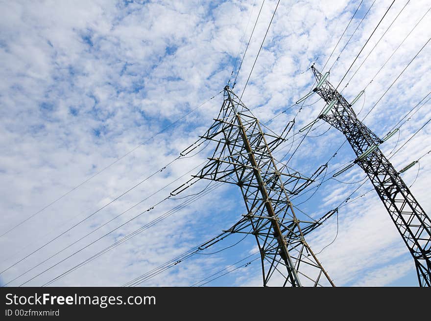 High voltage power line pillar on the background of sky