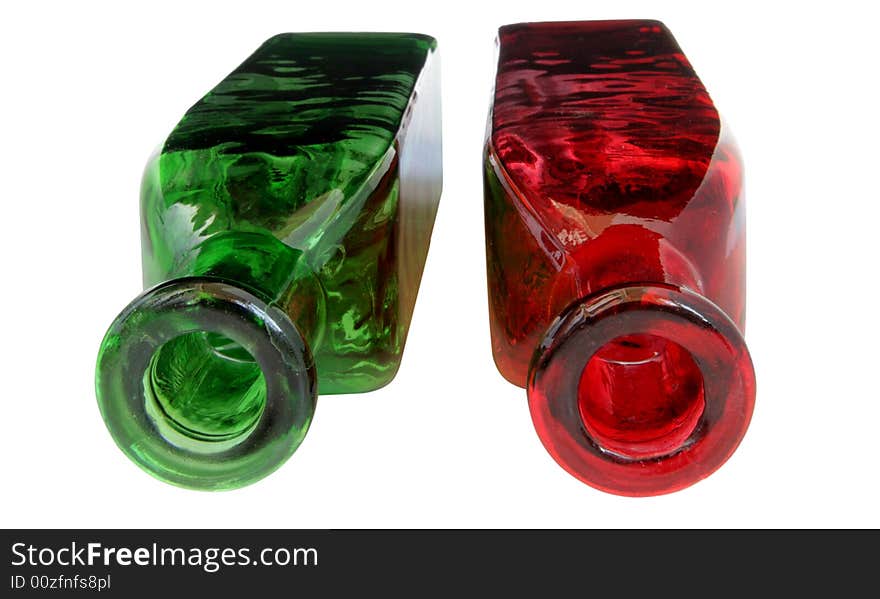 Red and green decorated bottles on white