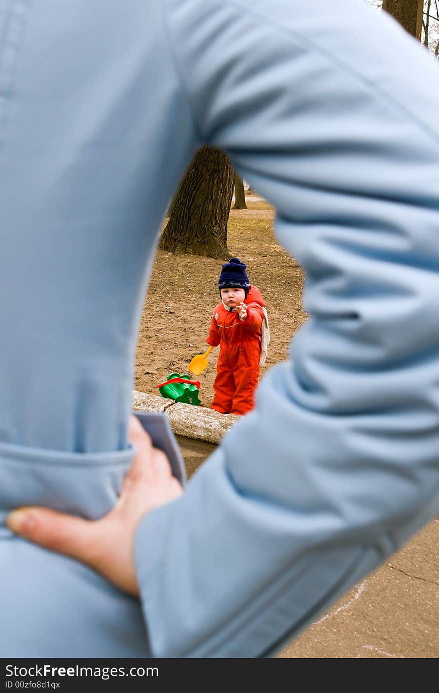 Child pulling a hand to mother. Child pulling a hand to mother