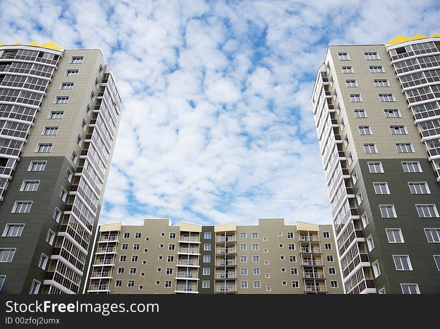 Three modern houses building on the background of sky. Three modern houses building on the background of sky