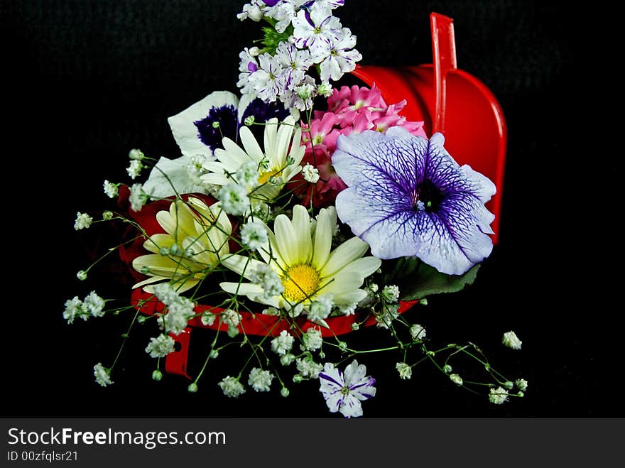 Fresh flowers in a red mailbox. Fresh flowers in a red mailbox.