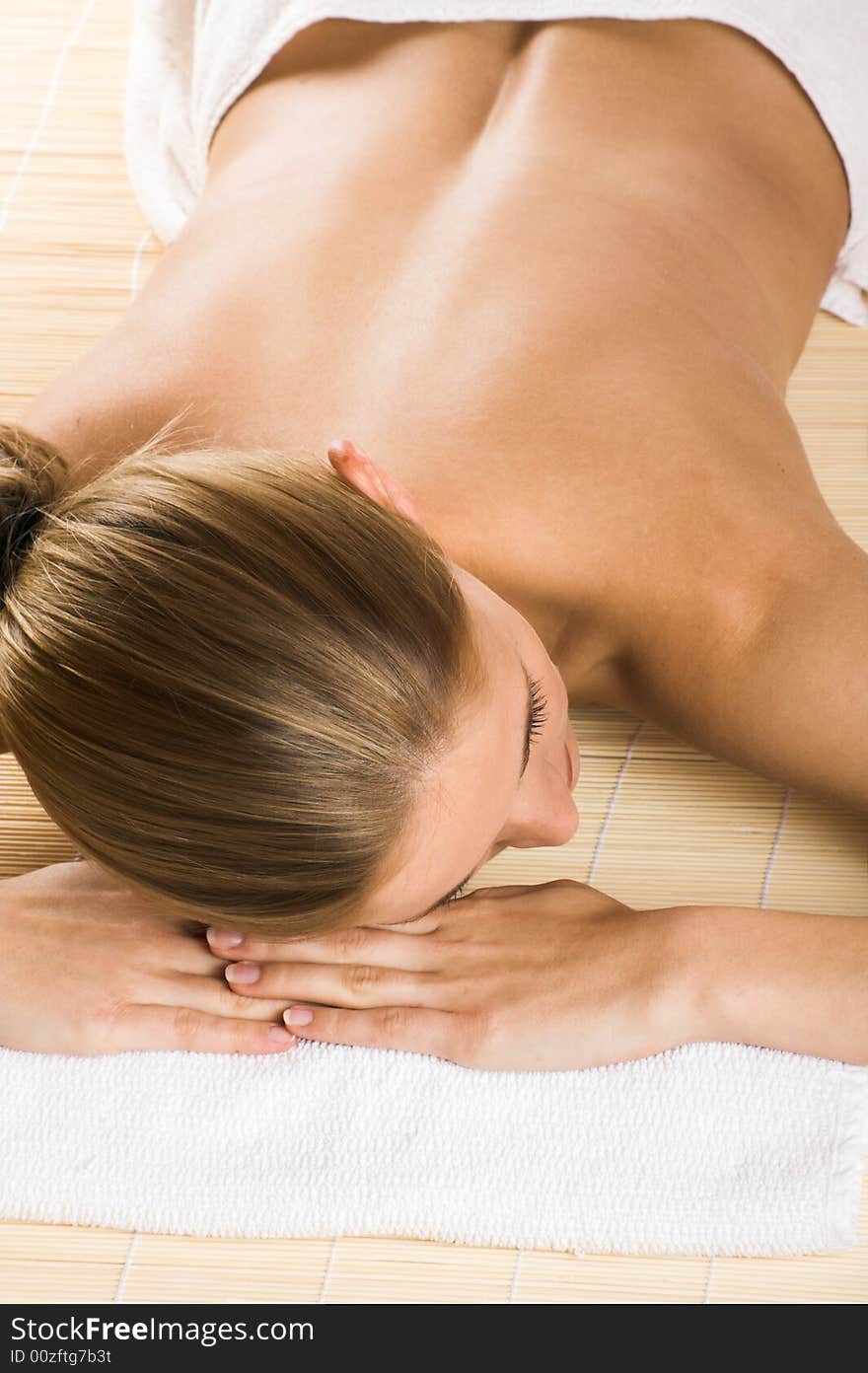 Young beautiful woman in a spa with towels. Young beautiful woman in a spa with towels