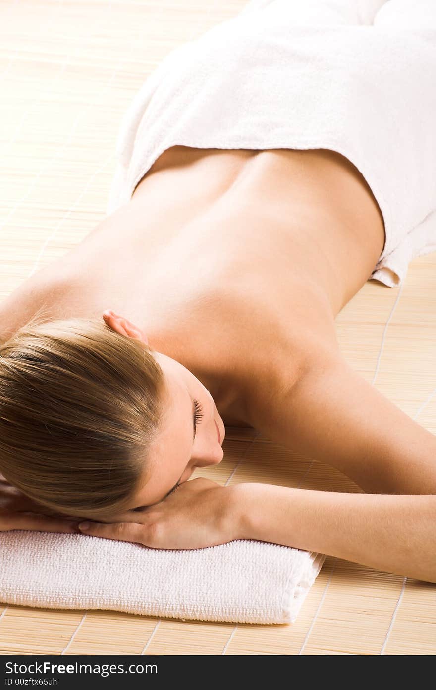 Young beautiful woman in a spa with towels. Young beautiful woman in a spa with towels