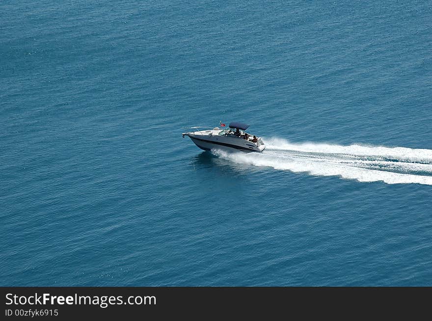 Speedboat cruising in the blue mediterranean