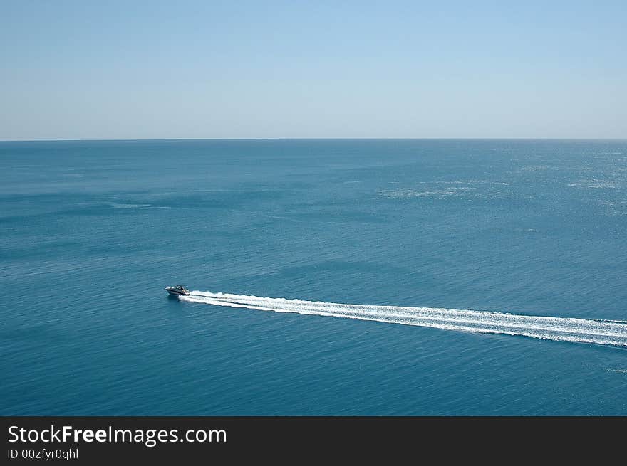 Speedboat cruising in the blue mediterranean