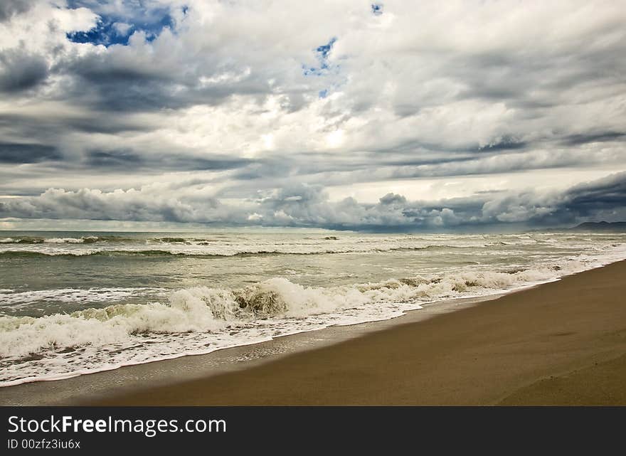 Empty Beach Duiring A Storm With Heavy Clouds