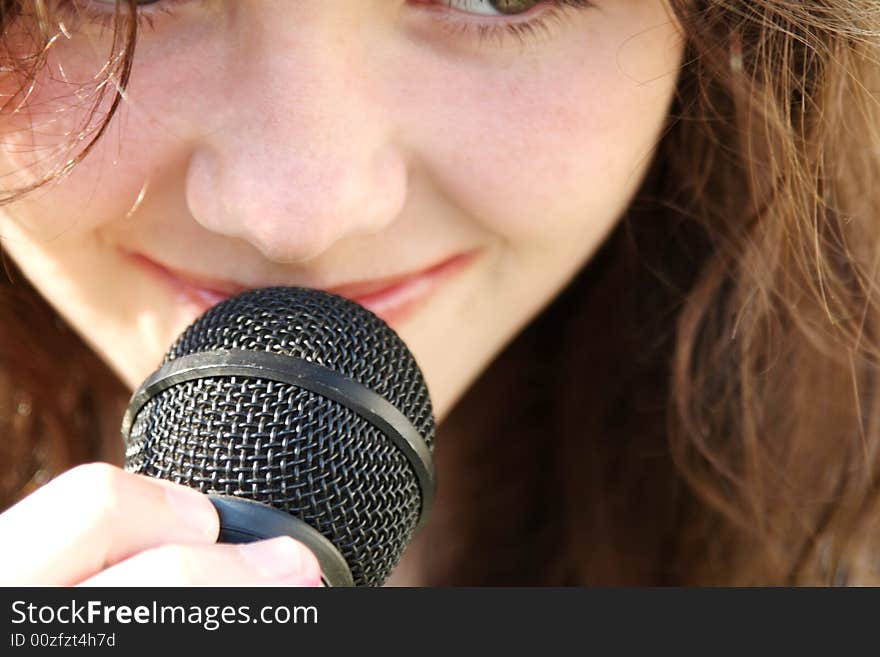 Young Beautiful Woman Singing