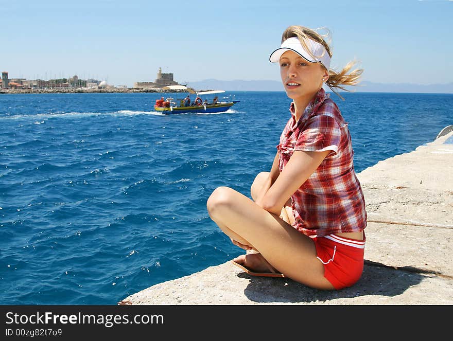 Girl sitting in the shipping port. Girl sitting in the shipping port