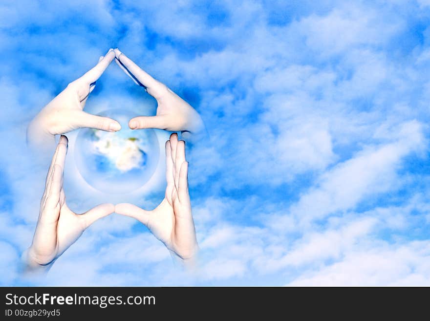 Hands of the person forming form house on background sky and cloud