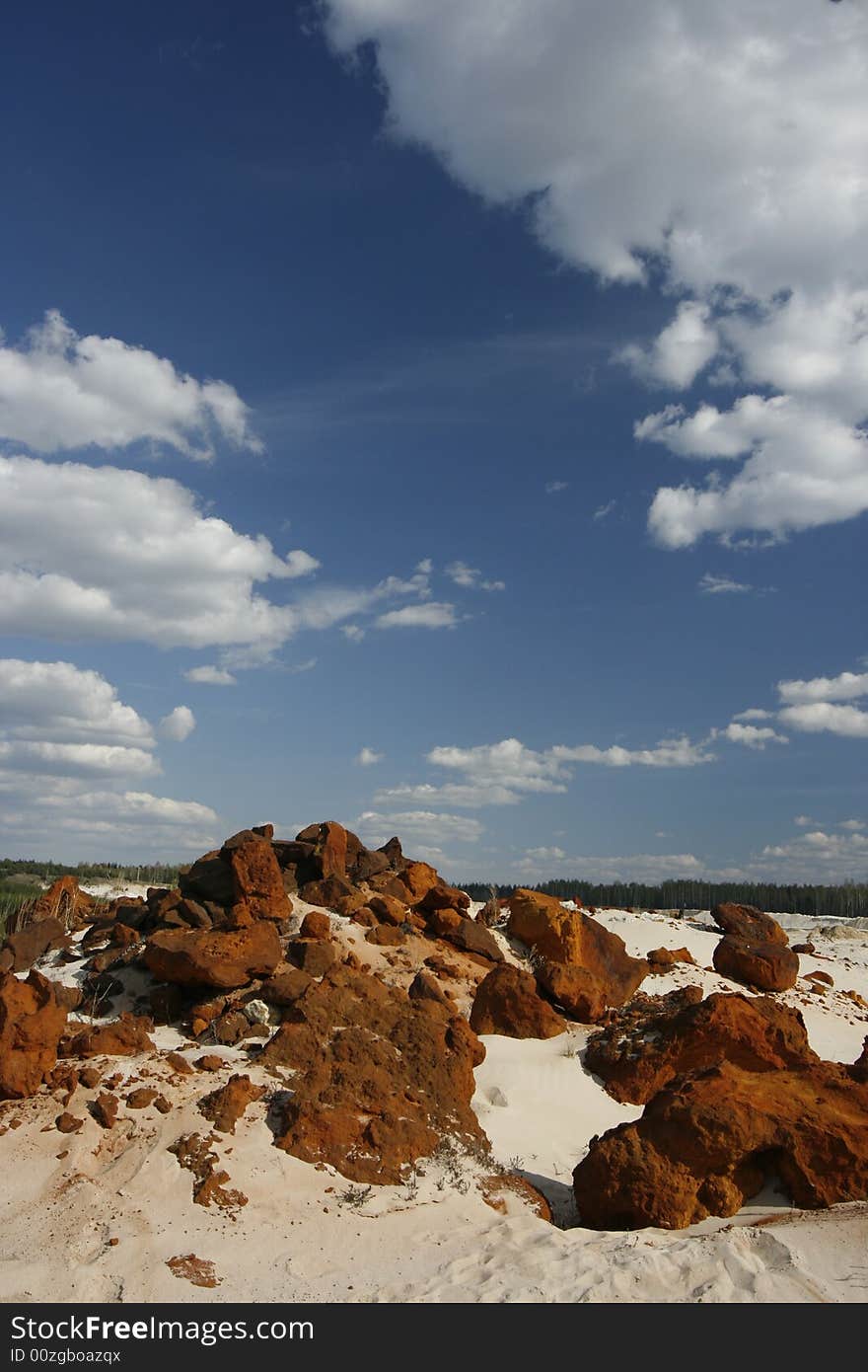 Red stones on the white sand