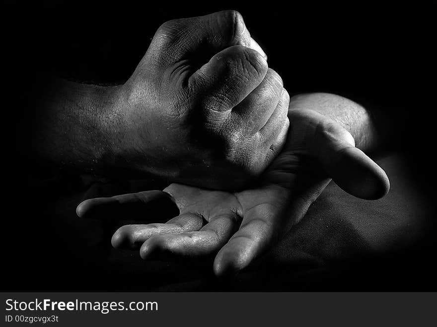 Close-up hands of the man over black. Close-up hands of the man over black