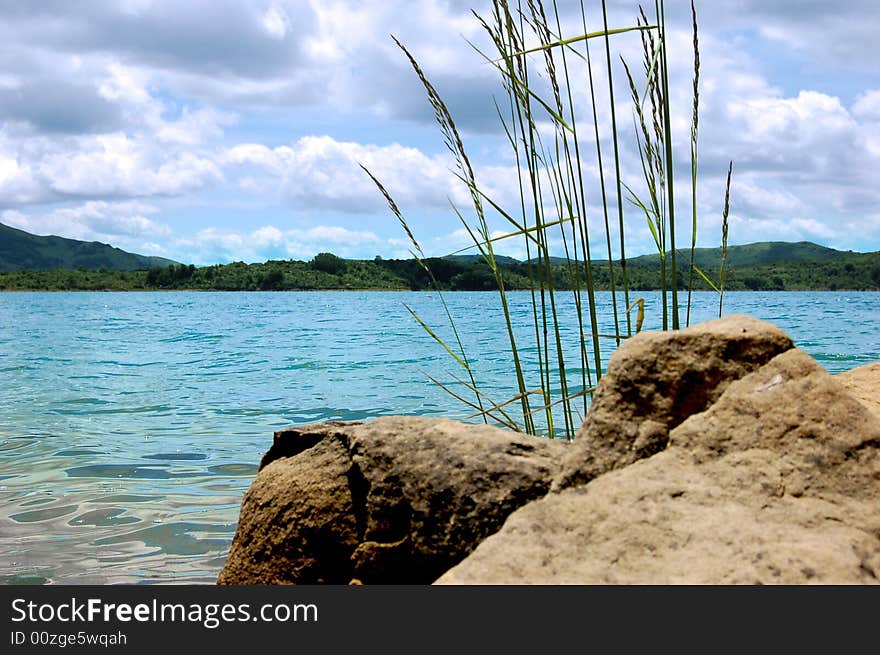 Stone, lake, mountains, sky, this is a nature whole. Stone, lake, mountains, sky, this is a nature whole.