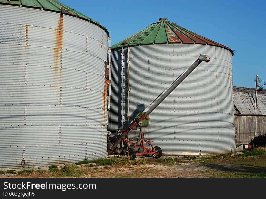 Rusty vintage Crop Storage bin with blue sky. Rusty vintage Crop Storage bin with blue sky