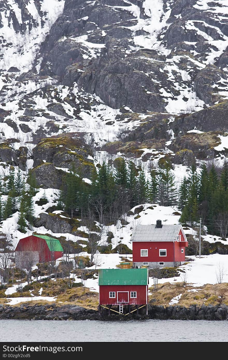 Red houses at the foot of a mountain. Red houses at the foot of a mountain