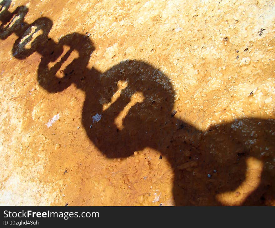 Old rusty iron chain shadow