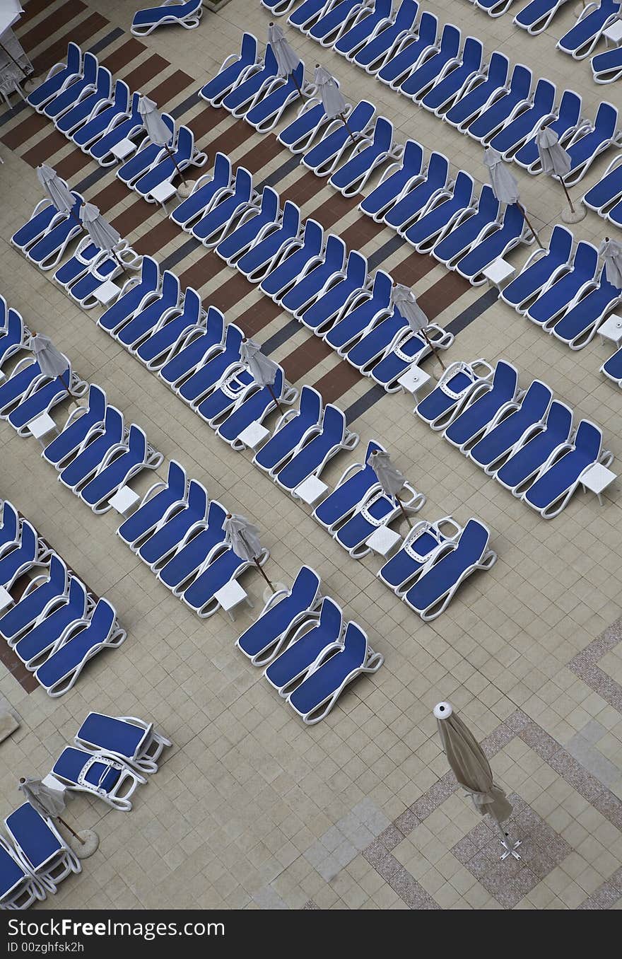 Chairs by swimming pool side. Chairs by swimming pool side