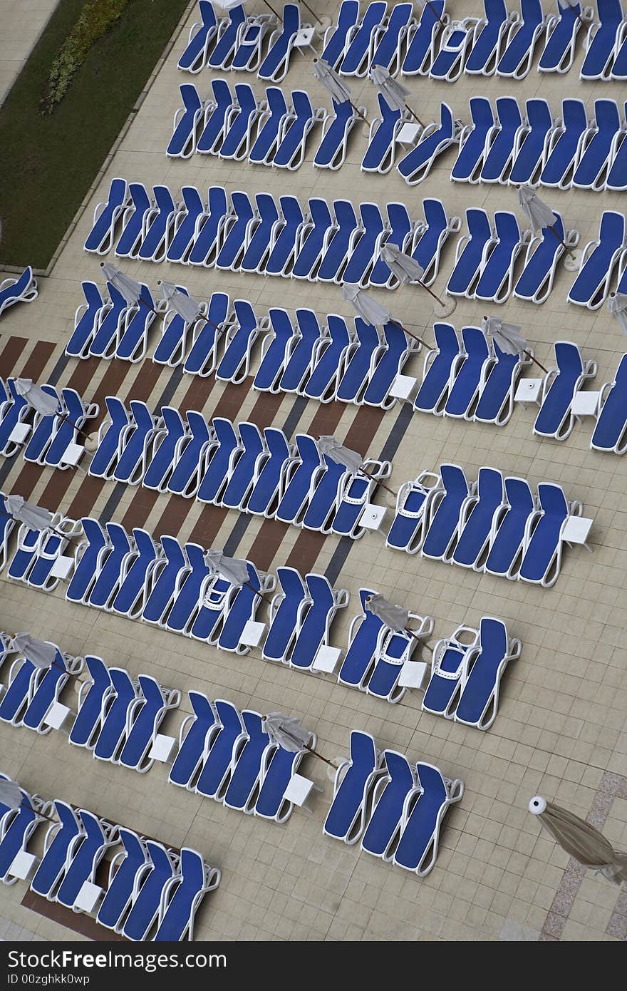 Chairs by swimming pool side. Chairs by swimming pool side