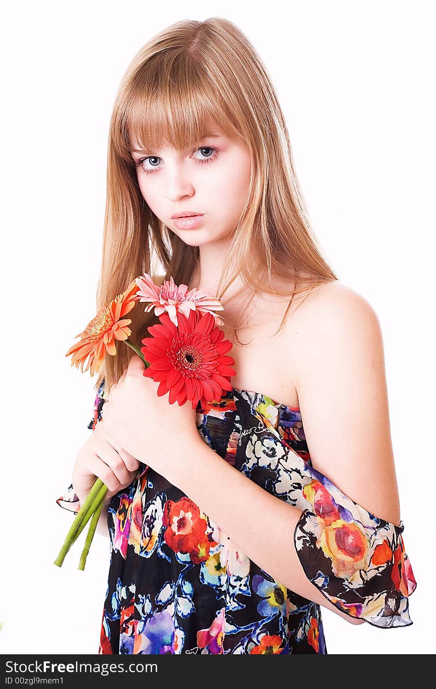 Beautiful girl in a bright dress with flowers on a white background. Beautiful girl in a bright dress with flowers on a white background