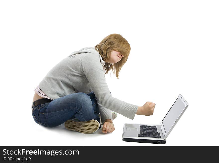 The young girl with the laptop isolated on a white