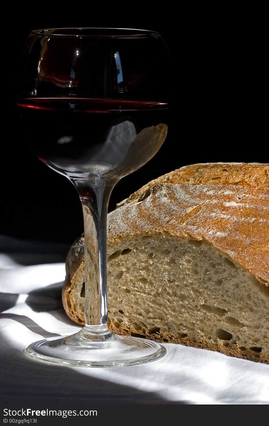 Glass of  red wine and fresh bread. Glass of  red wine and fresh bread