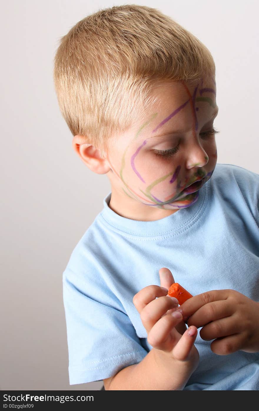 Laughing Toddler playing with colored pens making a mess. Laughing Toddler playing with colored pens making a mess