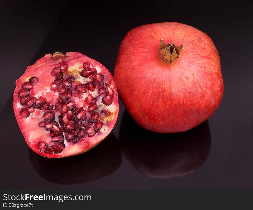 Pomegranates With One Cut Open,