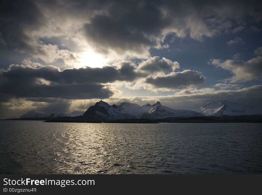 Snow-covered mountains at the Arctic ocean. Snow-covered mountains at the Arctic ocean