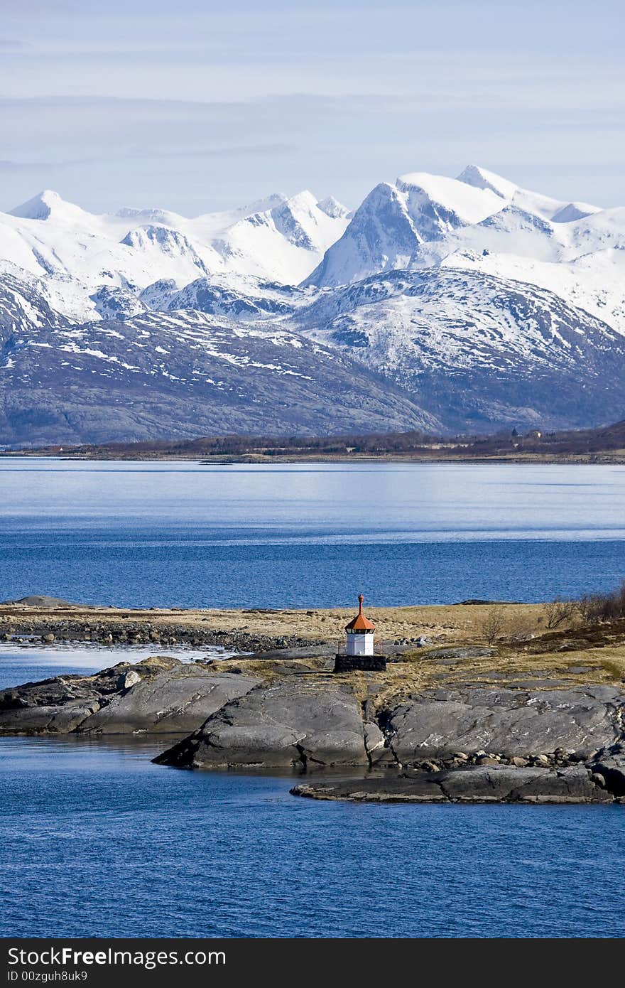 Snow-covered mountains at the Arctic ocean. Snow-covered mountains at the Arctic ocean