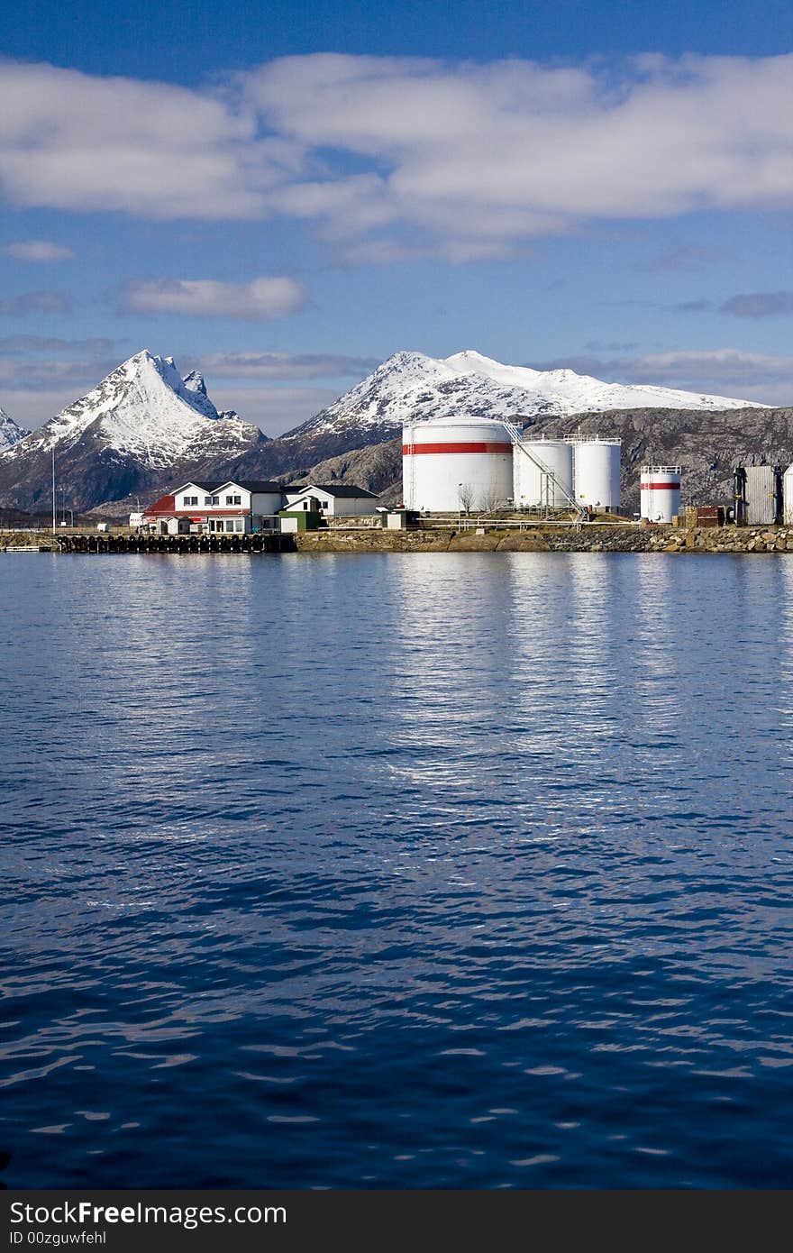 Snow-covered mountains, port, industry, oil. Snow-covered mountains, port, industry, oil