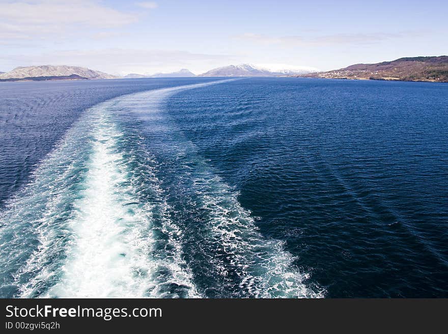 Tail of the ship, mountains on the horizon. Tail of the ship, mountains on the horizon