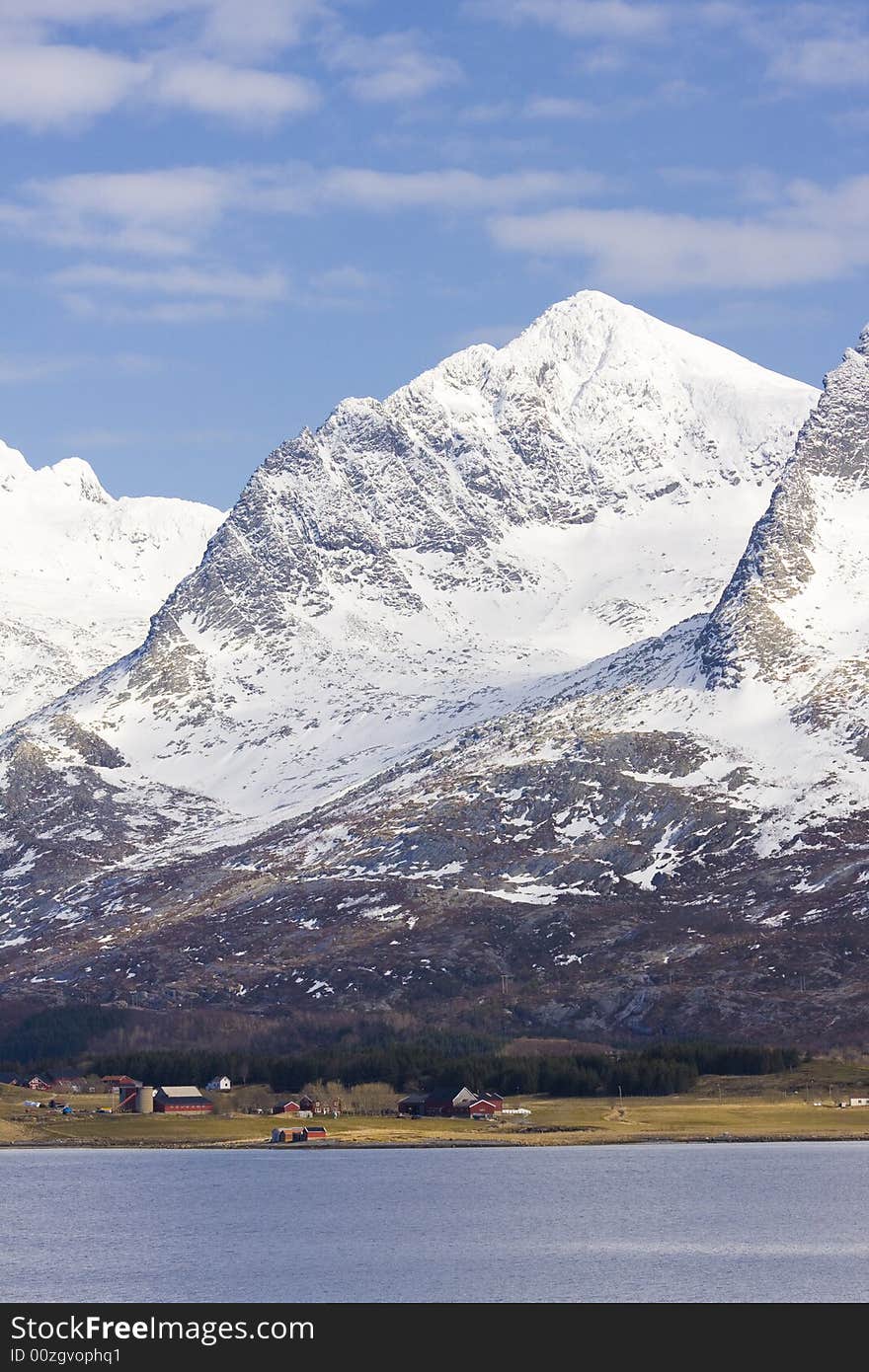 Houses before mountains