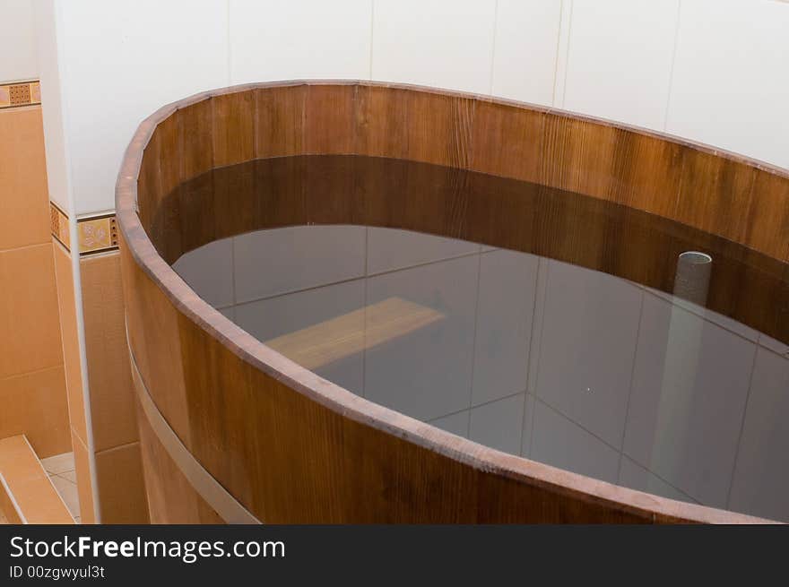 Wooden bath tub in the sauna