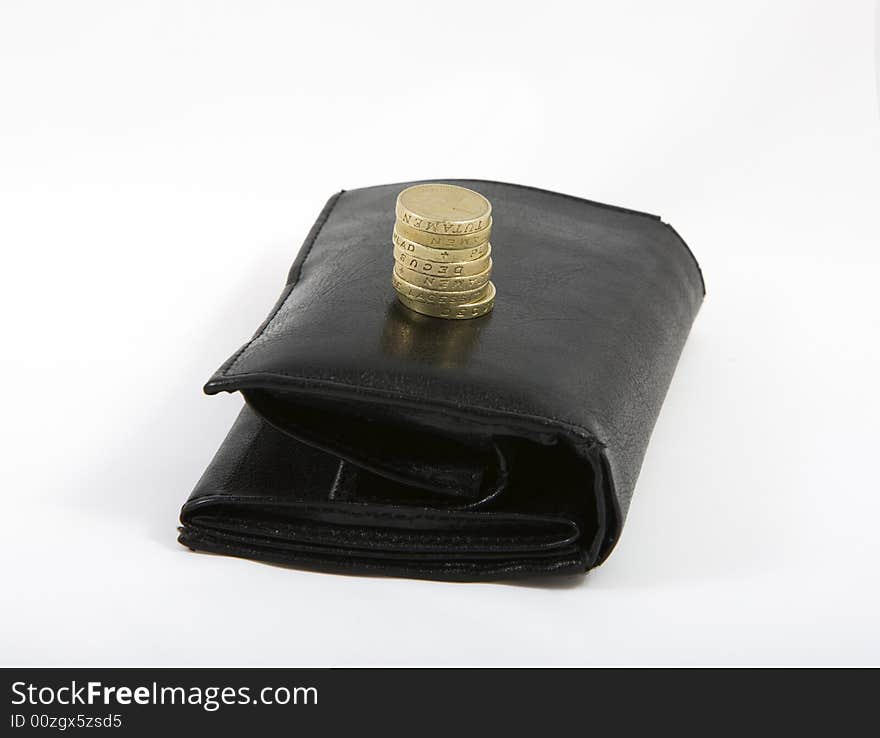 Black wallet with english pounds isolated on white bacground