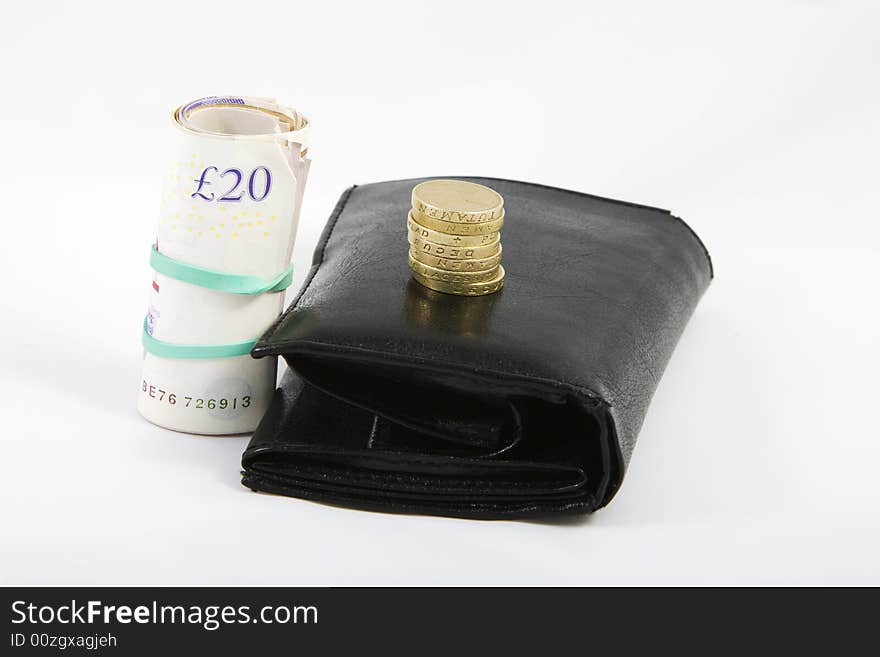 Black wallet with english pounds isolated on white bacground