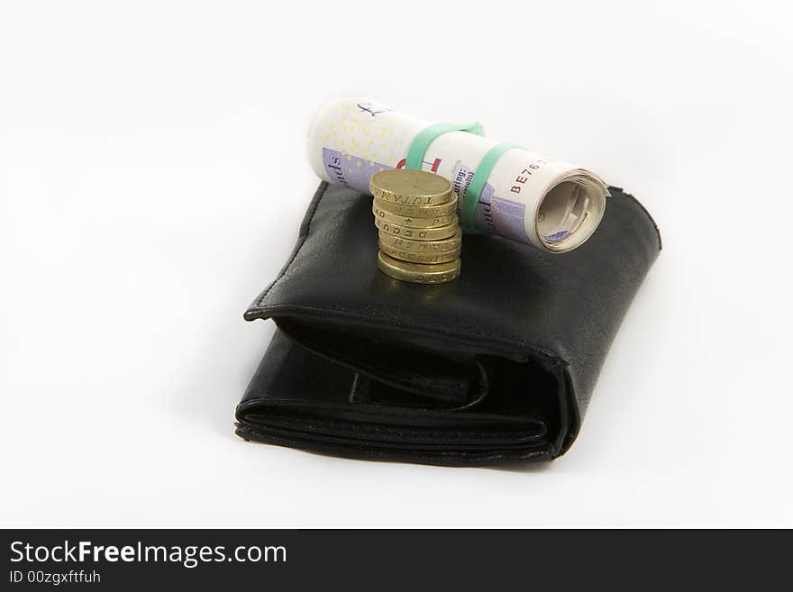 Black wallet with english pounds isolated on white bacground