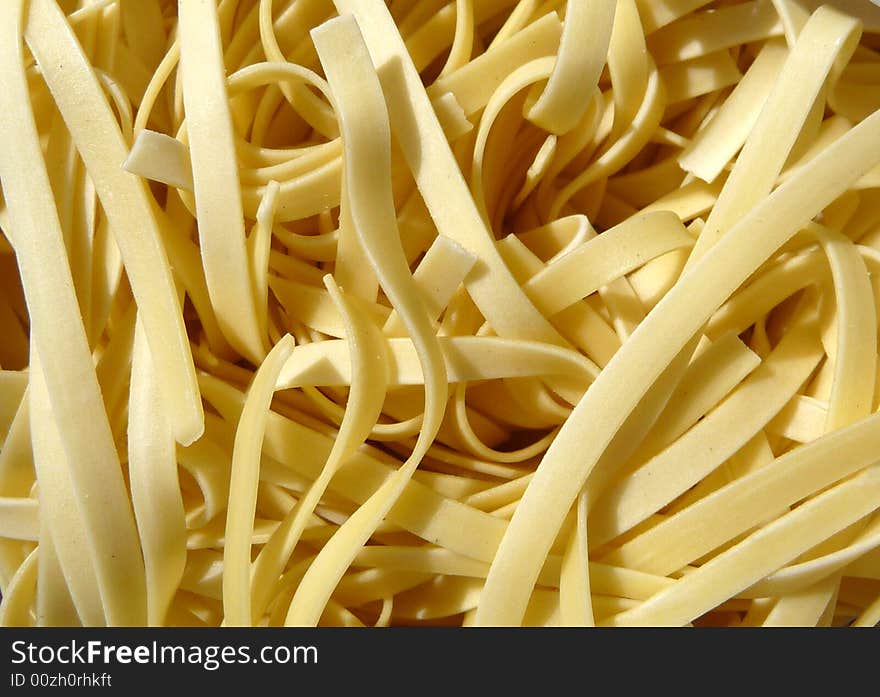 A close up photo of a set of stir fry noodles. A close up photo of a set of stir fry noodles.