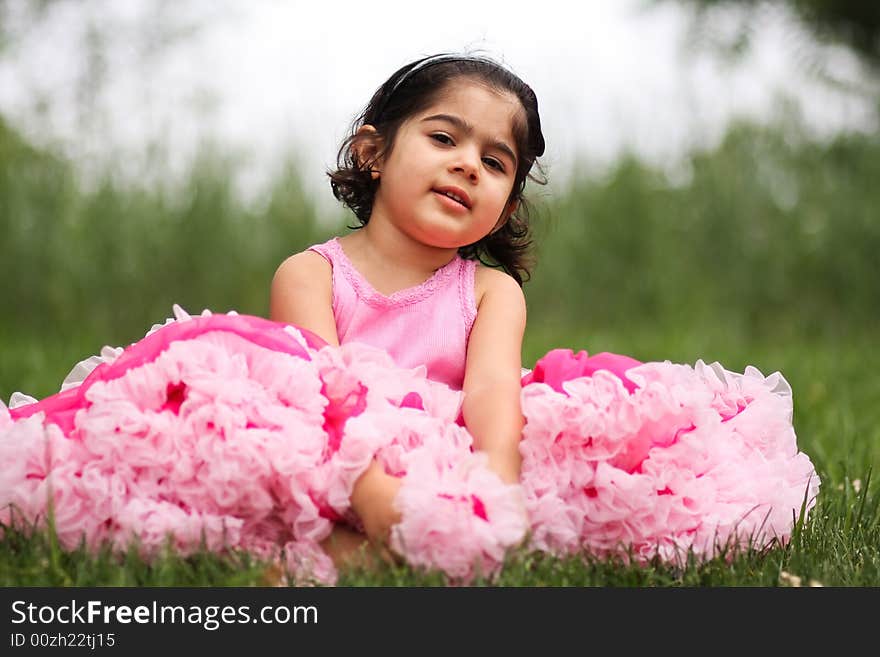 Cute girl in a flower garden wearing a cute pettiskirt. Cute girl in a flower garden wearing a cute pettiskirt