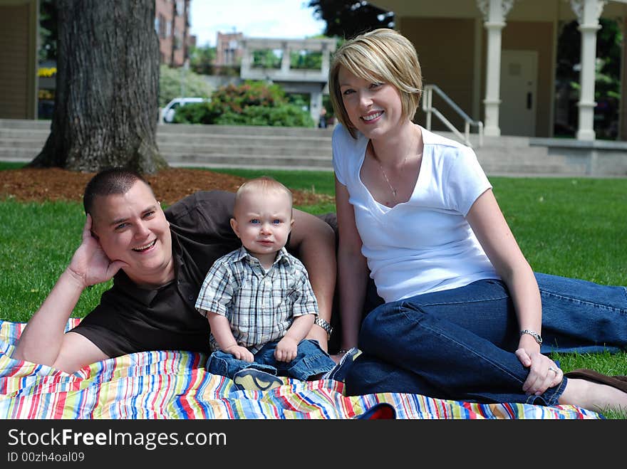 Family Lying Together in Grass - horizontal