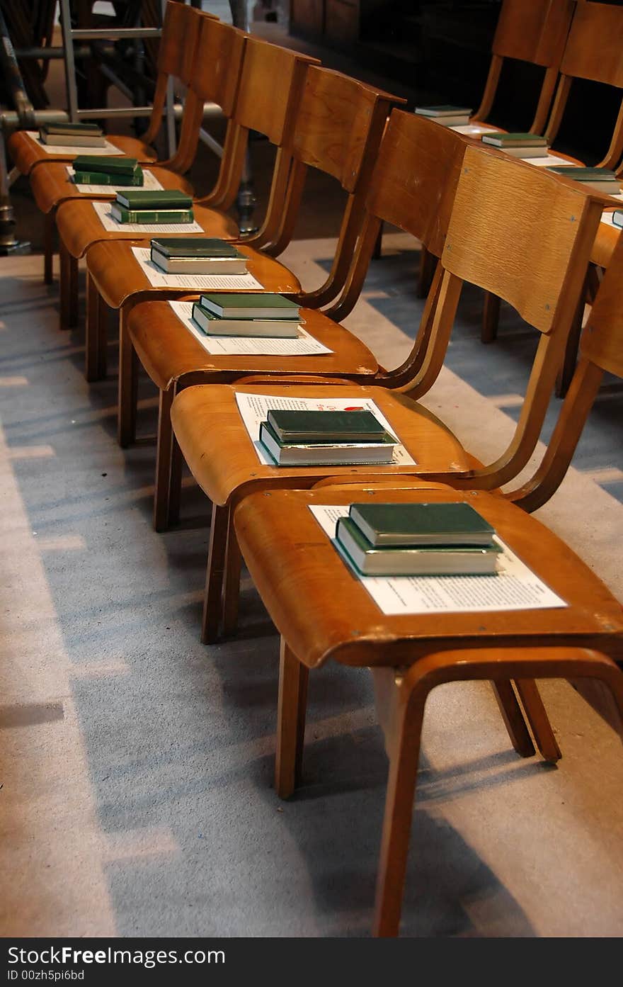 Row of chairs with bible on it in a cathedral. Row of chairs with bible on it in a cathedral