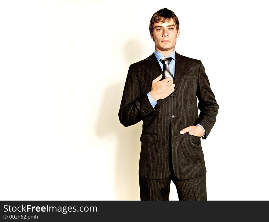 A male model photographed in the studio.