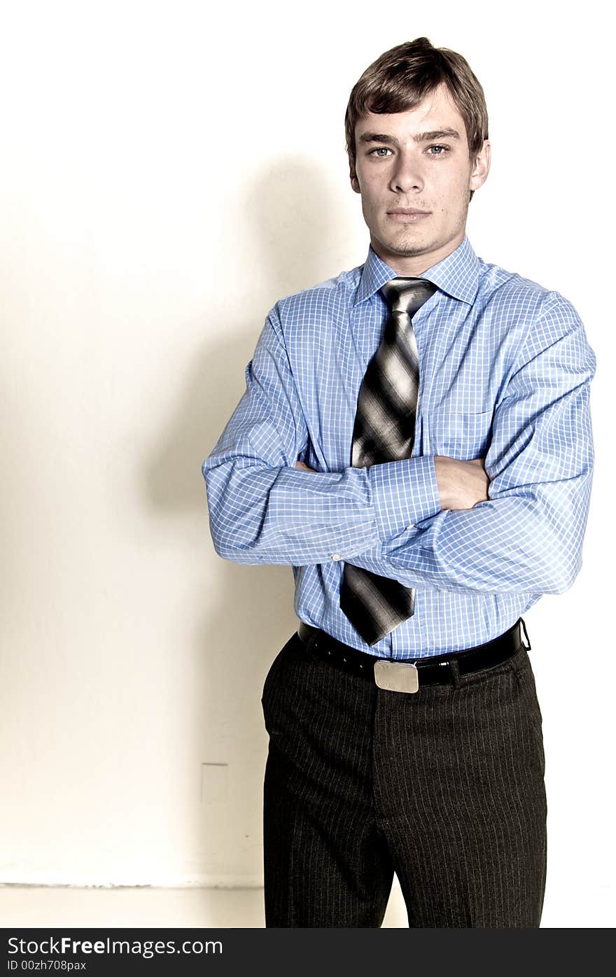 A male model photographed in the studio.