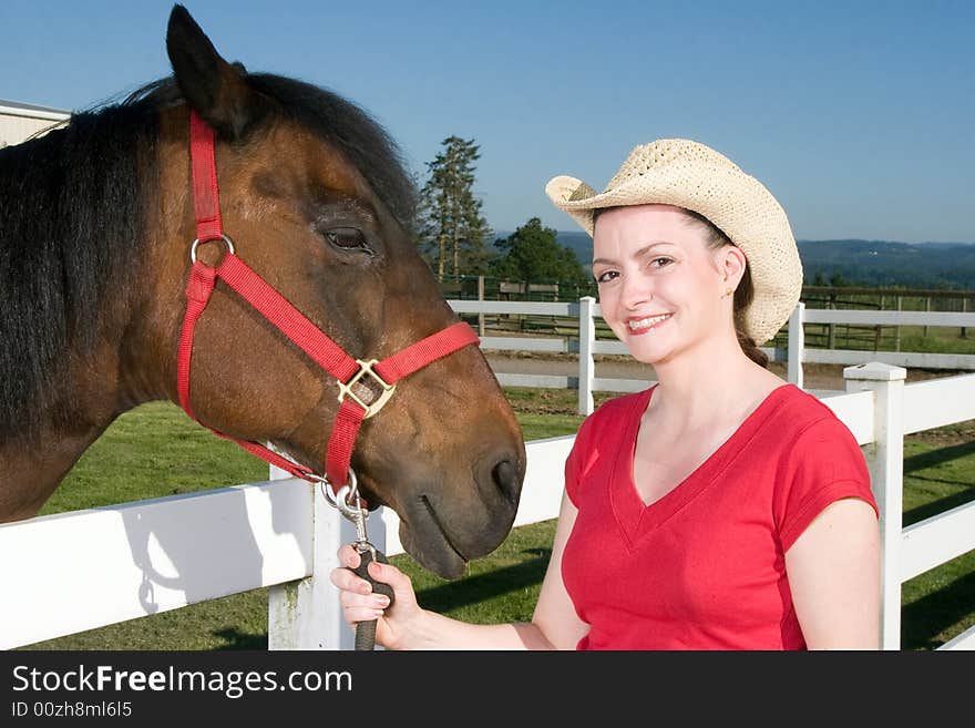 Woman in Cowboy Hat With Horse - Horizontal