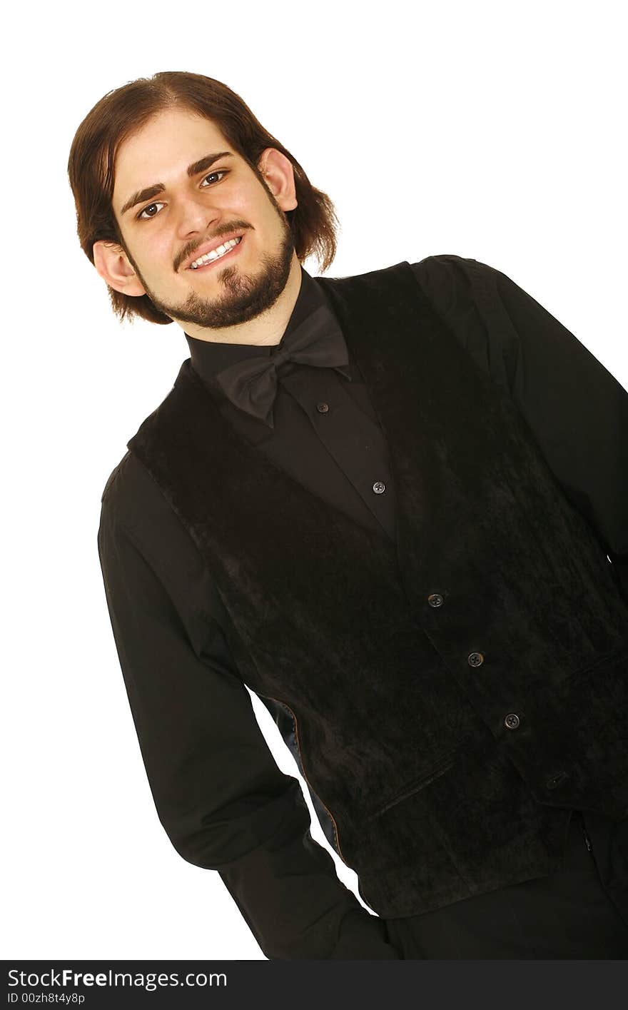 Happy young man in black vest and bow tie ready to party