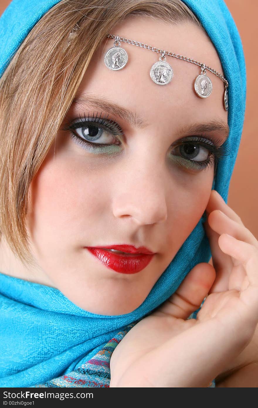 Female model with blue eyes wearing traditional folk dress