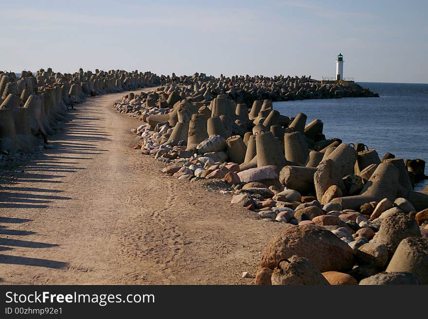 Pier in Baltic Sea near big port